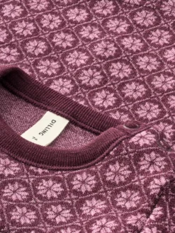 Bluse i merinould med nordisk mønster til baby