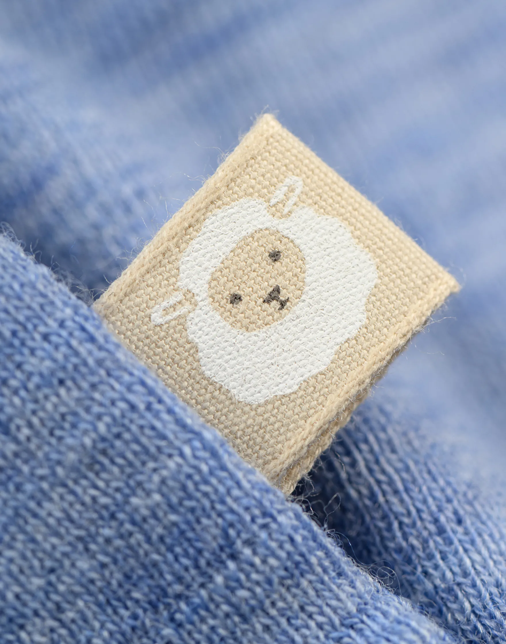 Bluse i merinould til baby