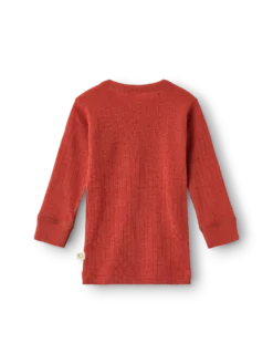 Bluse i merinould til baby