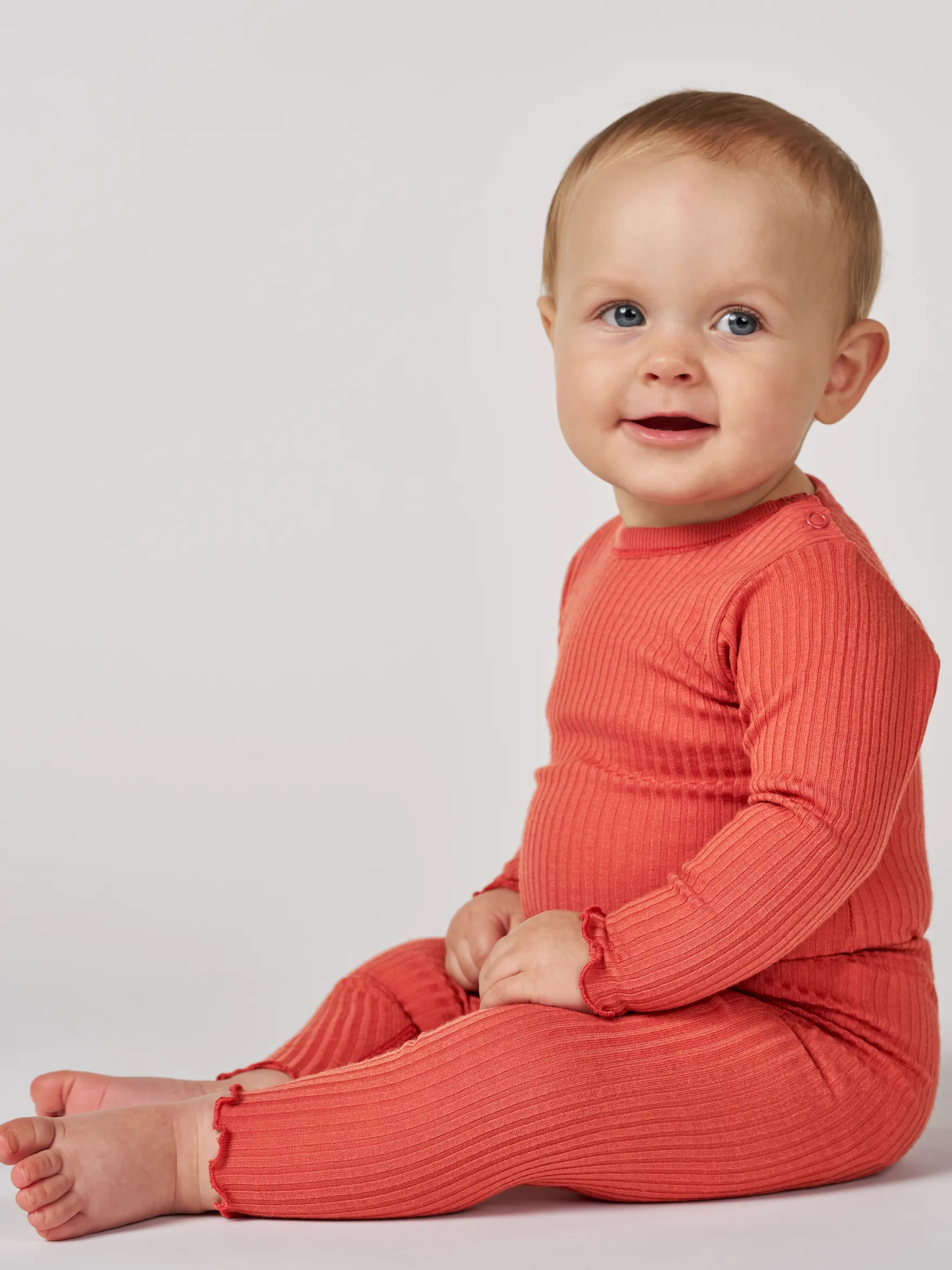 Body med lange ærmer i merinould til baby