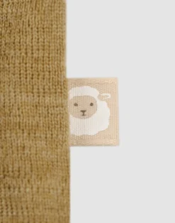 Kjole med flæser i merinould til baby