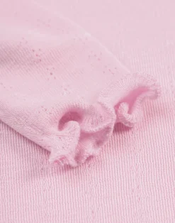 Langærmet body med hulmønster i merinould/silke til baby