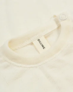 Langærmet body med hulmønster i merinould/silke til baby
