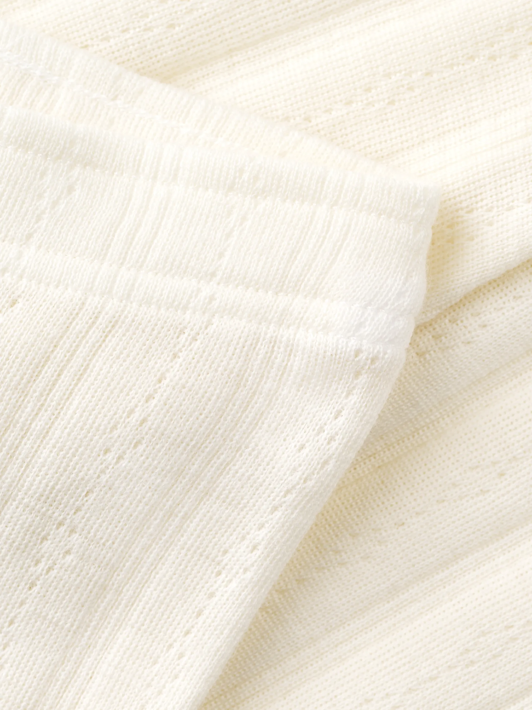 Leggings i merinould med hulmønster til baby