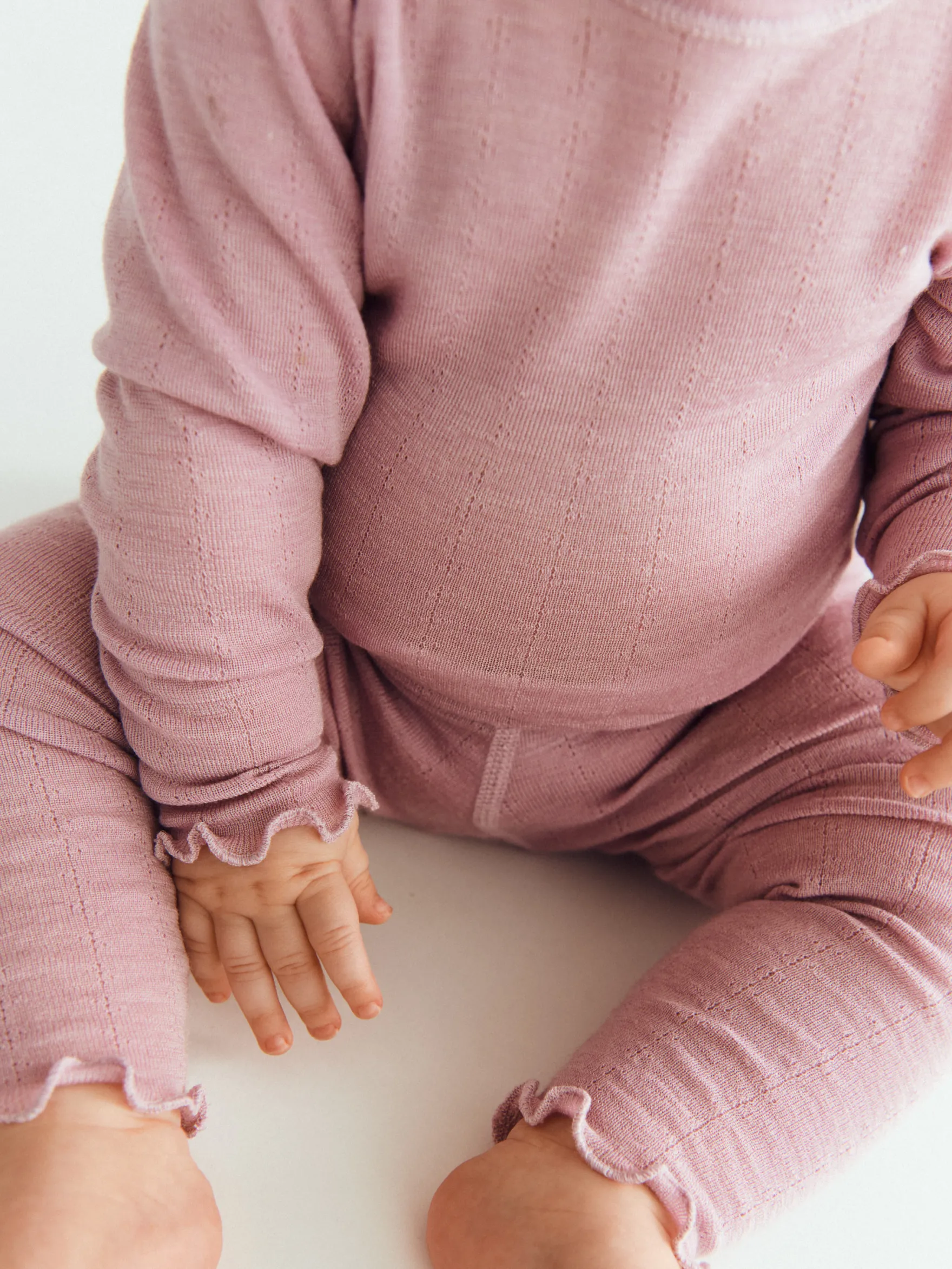 Leggings med hulmønster i merinould/silke til baby